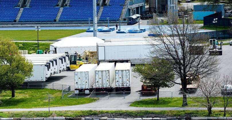 April 14, 2020, New York Manhattan, USA: 69 refrigerated trailers sat in a parking lot outside of Icahn Stadium on Randall s Island. The island has recently been transformed into a temporary morgue for the dead, as trenches are being dug on Hart Island in the NYC to store unclaimed bodies. Death toll in N.Y. 6,182 as confirmed cases 106,813 04 11 20. New York Manhattan Randalls Island Icahn Stadium New York Manhattan USA - ZUMAs252 20200414_znp_s252_011 Copyright: xMarcusxSantosx