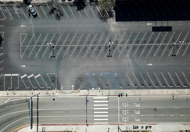 April 14, 2020, Los Angeles, California, U.S: An aerial view shows an empty parking lot near the 110 Harbor Freeway Tuesday April 14, 2020 in Los Angeles. Los Angeles U.S. - ZUMAc68_ 20200414_zaf_c68_004 Copyright: xRingoxChiux