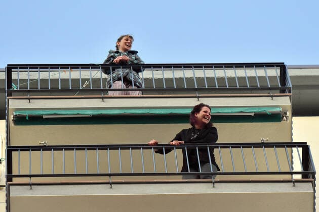 April 14, 2020, LÂ Hospitalet, Barcelona, Spain: People applaud Covid-19 fighters from their terrace during confinement..Citizens of LÂ Hospitalet at 8:00 pm continue to applaud showing gratitude to the people who are struggling in the fight against the Covid-19 health crisis, they give each other hope. LÂ Hospitalet Spain - ZUMAs197 20200414_zaa_s197_114 Copyright: xRamonxCostax