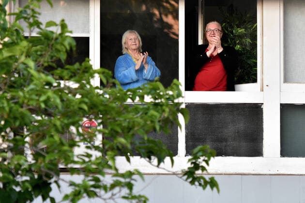 April 14, 2020, LÂ Hospitalet, Barcelona, Spain: People applaud Covid-19 fighters from their terrace during confinement..Citizens of LÂ Hospitalet at 8:00 pm continue to applaud showing gratitude to the people who are struggling in the fight against the Covid-19 health crisis, they give each other hope. LÂ Hospitalet Spain - ZUMAs197 20200414_zaa_s197_127 Copyright: xRamonxCostax