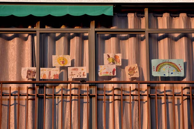April 14, 2020, LÂ Hospitalet, Barcelona, Spain: A terrace window with drawings made by children and phrases applauding Covid-19 fighters during confinement..Citizens of LÂ Hospitalet at 8:00 pm continue to applaud showing gratitude to the people who are struggling in the fight against the Covid-19 health crisis, they give each other hope. LÂ Hospitalet Spain - ZUMAs197 20200414_zaa_s197_137 Copyright: xRamonxCostax