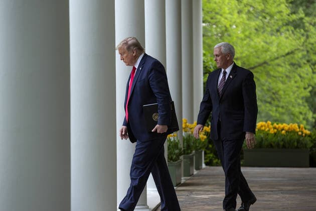 United States President Donald J. Trump, left, and United States Vice President Mike Pence arrive to a news conference in the Rose Garden of the White House in Washington D.C., U.S. on Tuesday, April 14, 2020. Trump announced that he has instructed his administration to halt funding to the World Health Organization (WHO).  WAX20200414330 STEFANIExREYNOLDS