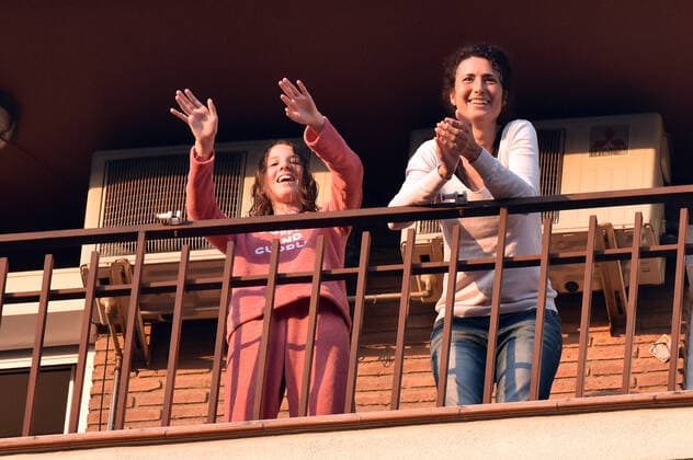 April 14, 2020, LÂ Hospitalet, Barcelona, Spain: People applaud Covid-19 fighters from their terrace during confinement. Citizens of LÂ Hospitalet at 8:00 pm continue to applaud showing gratitude to the people who are struggling in the fight against the Covid-19 health crisis, they give each other hope. LÂ Hospitalet Spain - ZUMAs197 20200414_zaa_s197_131 Copyright: xRamonxCostax