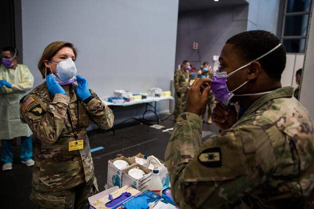 April 15, 2020, Manhattan, New York, United States Of America: NEW YORK (April 14, 2020) Army Lt. Gen. Laura Richardson, left, commanding general of U.S. Army North, puts on personal protective equipment before entering the patient care area at the Javits New York Medical Station, April 12, 2020. In support of the Department of Defense COVID-19 response, U.S. Northern Command, through U.S. Army North, is providing military support to the Federal Emergency Management Agency to help communities in need. Manhattan United States Of America - ZUMAs214 20200415_zaa_s214_003 Copyright: xSMGx