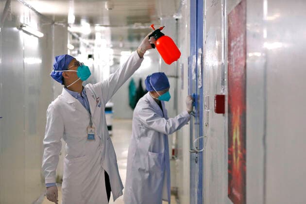 (200415) -- WUHAN, April 15, 2020 -- Medical workers conduct disinfection at Leishenshan (Thunder God Mountain) Hospital in Wuhan, capital of central China s Hubei Province, April 15, 2020. Wuhan Leishenshan (Thunder God Mountain) Hospital ceased operation in Wuhan on Wednesday as the coronavirus epidemic wanes. ) CHINA-HUBEI-WUHAN-LEISHENSHAN HOSPITAL-RETIRING (CN) ShenxBohan 