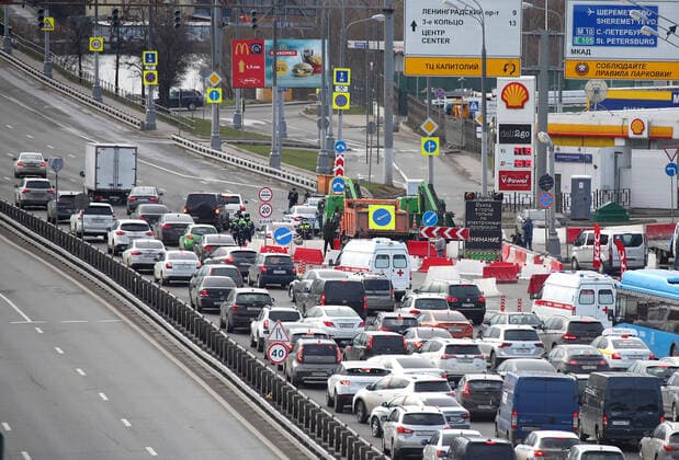 MOSCOW, RUSSIA - APRIL 15, 2020: A traffic congestion at a checkpoint on Leningradskoye Shosse Motorway at the entrance to Moscow during the pandemic of the novel coronavirus disease (COVID-19). Traffic police have set up checkpoints around the city to stop vehicles and see if drivers have permission to travel during the lockdown. On 13 April 2020, the Moscow government introduced a digital permit system aimed at further restricting movement. Under the new scheme, which becomes mandatory from 15 April, people need to apply for permits to travel on a vehicle or public transport around the city. Earlier, on 11 April, the Moscow government restricted vehicles registered outside Moscow Region from entering the Russian capital. Since 30 March 2020, Moscow has been on lockdown. As of 15 April 2020, Russia has reported more than 21,100 confirmed  TS0D5C84