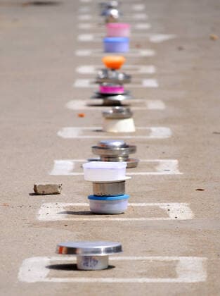 CHANDIGARH, INDIA - APRIL 15: People keep their utensils in the marked boxes as they wait at a food distribution during lockdown against Coronavirus, at a slum, in Industrial area Phase 1 on April 15, 2020 in Chandigarh, India. (Photo by Anil Dayal Hindustan Times) Government Provide Food To Homeless And Poor Amid Lockdown To Prevent Covid-19