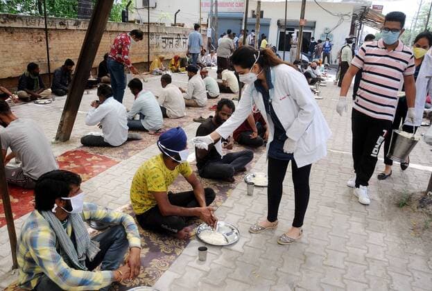 PATIALA, INDIA - APRIL 15: Team of Doctors Screening the people before eating the Langar near Railway Station on April 15, 2020 in Patiala, India. (Photo by Bharat bhushan Hindustan Times) Government Provide Food To Homeless And Poor Amid Lockdown To Prevent Covid-19