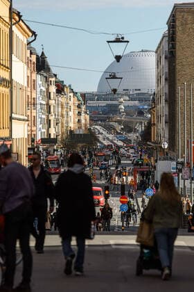 200415 People walking on Götgatan in front of Globen, as the coronavirus, COVID-19, outbreak continues on April 15, 2020 in Stockholm. Sweden stands out among countries in the world with so far comparatively very few public restrictions during the coronavirus pandemic. Photo: Maxim ThorÃ BILDBYRAN kod MT Copyright: MAXIMxTHORE BB200415BB015