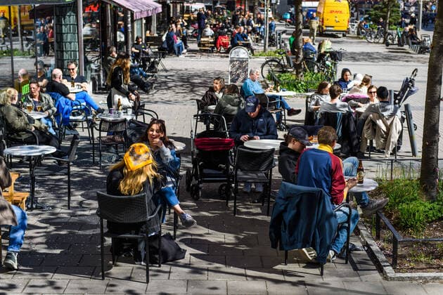 200415 People gather at a outdoor restaurant, as the coronavirus, COVID-19, outbreak continues on April 15, 2020 in Stockholm. Sweden stands out among countries in the world with so far comparatively very few public restrictions during the coronavirus pandemic. Photo: Maxim ThorÃ BILDBYRAN kod MT Copyright: MAXIMxTHORE BB200415BB032