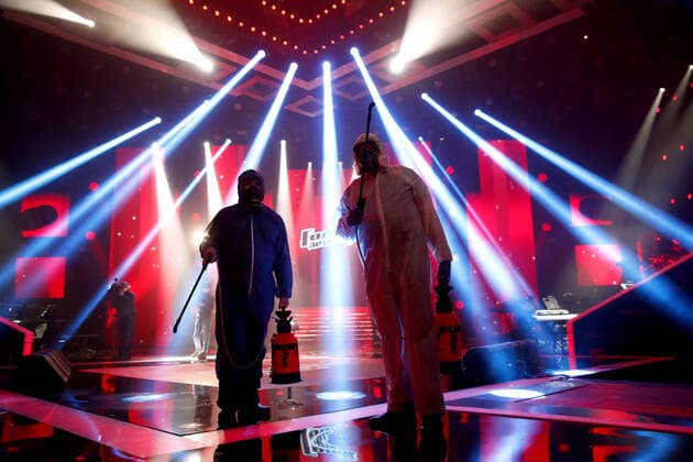 MOSCOW, RUSSIA - APRIL 16, 2020: Workers in protective suits disinfecting the studio of The Voice Kids Russia reality TV singing competition ahead of a live broadcast scheduled for April 17; the shooting will be held without spectators and with the fewest possible members of the crew. Artyom Geodakyan TASS  TS0D60E5