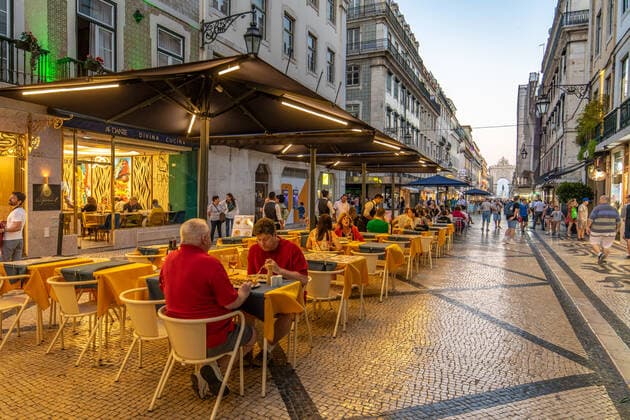 People Sitting at Tables Outside of Restaurants on a City Street , Lisbon, Portugal Lisbon Portugal Copyright: xEdwinxRemsbergx xVWPicsx ERE-remsberg_190720104546