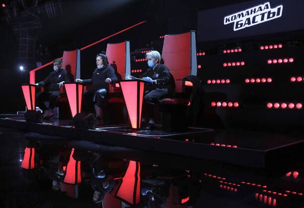 MOSCOW, RUSSIA - APRIL 17, 2020: Musician Vasily Vakulenko (Basta), left, and judges while filming a live broadcast of an episode of The Voice Kids Russia reality television singing competition. The show is shot without audience amid the COVID-19 coronavirus pandemic. Vyacheslav Prokofyev TASS  TS0D62C4