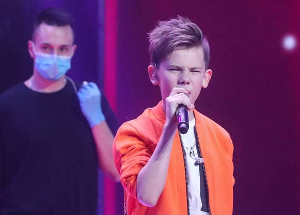 MOSCOW, RUSSIA - APRIL 17, 2020: A contestant while filming a live broadcast of an episode of The Voice Kids Russia reality television singing competition. The show is shot without audience amid the COVID-19 coronavirus pandemic. Vyacheslav Prokofyev TASS  TS0D62CB