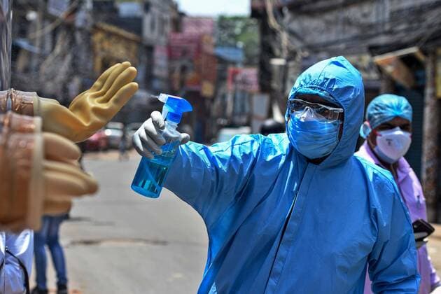 NEW DELHI, INDIA - APRIL 21: A health worker sanitizes a mobile testing van used for taking swab samples from residents of the Hauz Qazi area for COVID-19 antibody rapid testing as a precautionary measure during lockdown on April 21, 2020 in New Delhi, India. (Photo by Biplov Bhuyan Hindustan Times) Antibody Rapid Testing In Delhi In View Of Covid-19 Pandemic