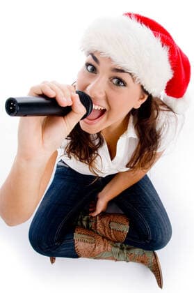 model holding karaoke and wearing christmas hat model holding karaoke and wearing christmas hat against white background  Copyright: ximagerymajesticx 713133
