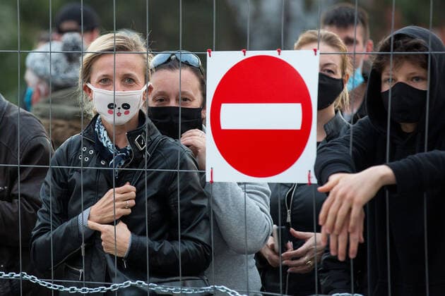 April 24, 2020, Zgorzelec, Poland: A woman wearing a face mask stands behind the fence on the German side of The Zgorzelec-Gorlitz Old Town Bridge during the demonstration..Hundreds of polish-Germany border residents protest against anti-virus measures as they block them from commuting to work on a daily basis. In response to the COVID-19 pandemic, both countries are requiring those entering to undergo a 14day quarantine period, though Germany makes an exception for cross border commuters, Poland does not. Zgorzelec Poland - ZUMAs197 20200424_zaa_s197_247 Copyright: xKarolxSerewisx