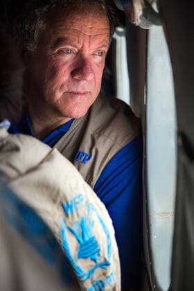 May 23 2017, Ganyiel South Sudan: The Executive Director of the United Nations World Food Programme (WFP), DAVID BEASLEY, looks through the window at the helicopter flying from Rumbek to Ganyiel, Unity region, South Sudan. The visit is part of the two-day joint mission of WFP and WFP directors in South Sudan to assess the humanitarian situation in the country. Ganyiel, in Panyijiar county is fully controlled by the opposition forces since the civil war broke out in South Sudan in December 2013. Thousands of people are currently displaced, mostly due to the conflict and the hunger in Unity region. While Leer and Mayendit, both also in Unity state, have been recently declared in famine, Panjiyiar is also in high risk. The malnutrition is very critical, with rates above 30% and Ganyiel has the only stabilisation in all central and southern U - ZUMAz03_ 20170523_int_z03_996 Copyright: xAlbertxGonzalezxFarran FAOx
