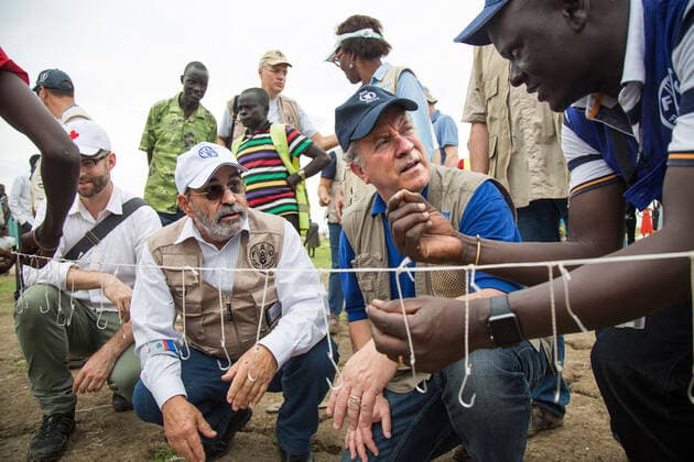 May 23 2017, Ganyiel South Sudan: (Center, Right to left) The Executive Director of the United Nations World Food Programme (WFP), DAVID BEASLEY, and the Director-General of the Food and Agriculture Organization of the United Nations, JOSE GRAZIANO DA SILVA, are briefed by a FAO officer on fishing hooks distribution for the community in Ganyiel, Unity region, South Sudan. The visit is part of the two-day joint mission of WFP and WFP directors in South Sudan to assess the humanitarian situation in the country. Ganyiel, in Panyijiar county is fully controlled by the opposition forces since the civil war broke out in South Sudan in December 2013. Thousands of people are currently displaced, mostly due to the conflict and the hunger in Unity region. While Leer and Mayendit, both also in Unity state, have been recently declared in famine, Panj - ZUMAz03_ 20170523_int_z03_991 Copyright: xAlbertxGonzalezxFarran FAOx