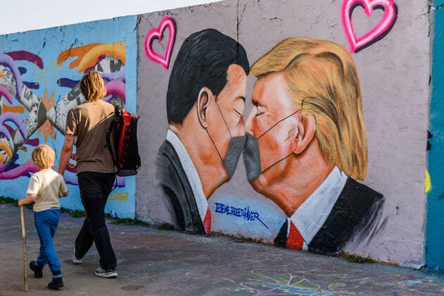 April 28, 2020, Berlin, Berlin, Germany: A man and a boy can be seen walking in front of a grafitti with portraits of US President DONALD TRUMP and President of the People s Republic of China XI JINPING wearing face masks at Berlin Mauerpark. US President Donald Trump has again blamed China for the outbreak of the coronavirus pandemic, which began in the Chinese city of Wuhan at the end of last year and has developed into a global pandemic. In the meantime, Trump spoke of the Chinese virus because the pathogen had been detected in a human being for the first time in the Chinese city of Wuhan with its millions of inhabitants. Berlin Germany - ZUMAs172 20200428_zap_s172_001 Copyright: xJanxScheunertx