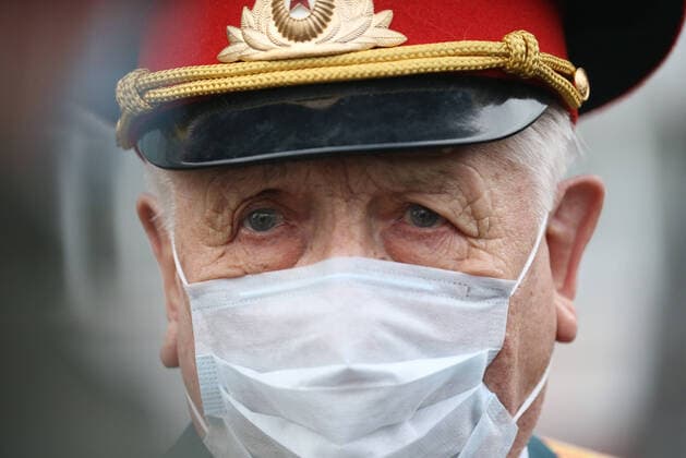 ST PETERSBURG, RUSSIA â€“ APRIL 30, 2020: Mikhail Polyachkov, a WWII veteran, during a private parade arranged for him as part of the Supporting Veterans initiative to mark the forthcoming Victory Day. This year, Russia is celebrating the 75th anniversary of the victory over Nazi Germany in the Great Patriotic War of 1941â€“1945 (the Eastern Front of World War II). Peter Kovalev Private parade for WWII veteran in St Petersburg