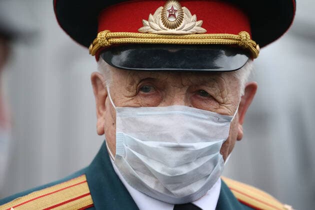 ST PETERSBURG, RUSSIA â€“ APRIL 30, 2020: Mikhail Polyachkov, a WWII veteran, during a private parade arranged for him as part of the Supporting Veterans initiative to mark the forthcoming Victory Day. This year, Russia is celebrating the 75th anniversary of the victory over Nazi Germany in the Great Patriotic War of 1941â€“1945 (the Eastern Front of World War II). Peter Kovalev Private parade for WWII veteran in St Petersburg