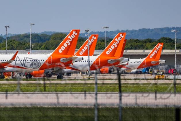 EasyJet planes grounded due to the coronavirus outbreak are parked at Gatwick Airport in Sussex, Wednesday, May 6, 2020. Last week British Airways announced plans that could see 12,000 jobs cut from its 42,000 strong workforces amidst a global collapse in air transport caused by the pandemic outbreak Covid19. (Photo Vudi Xhymshiti)  VXP