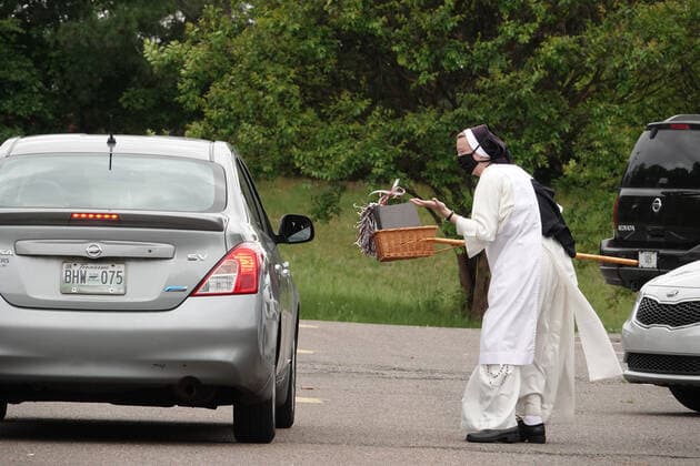 May 16, 2020, Memphis, Tennessee, USA: Eighth grade students who graduated from St. Paul Catholic School in Memphis, Tennessee were celebrated on Saturday May 16, 2020 with a car parade in the front of the school. The graduates received their packets with report cards, diploma from the principal, SISTER MARY LAWRENCE, O.P. They used a drive through method to follow guidelines because of COVID 19 virus in Memphis, which has just begun to slowly reopen. Memphis USA - ZUMAf103 20200516_zaf_f103_011 Copyright: xKarenxFochtx