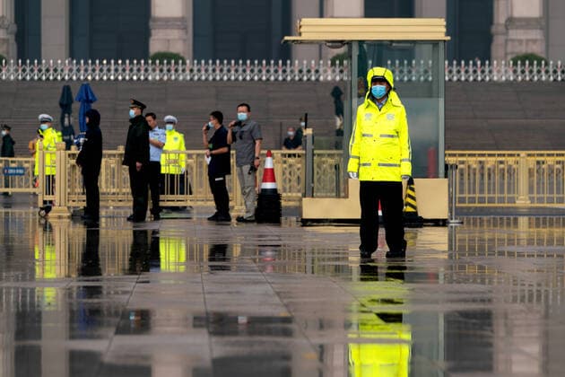 BEIJING, CHINA - MAY 21, 2020: Police officers in Tiananmen Square, outside the Great Hall of the People, the venue of the opening meeting of the third session of the 13th National Committee of the Chinese People s Political Consultative Conference (CPPCC). The opening meeting of the session was to be held on 3 March 2020 but was postponed due to the COVID-19 pandemic. Artyom Ivanov TASS  TS0D9EC4