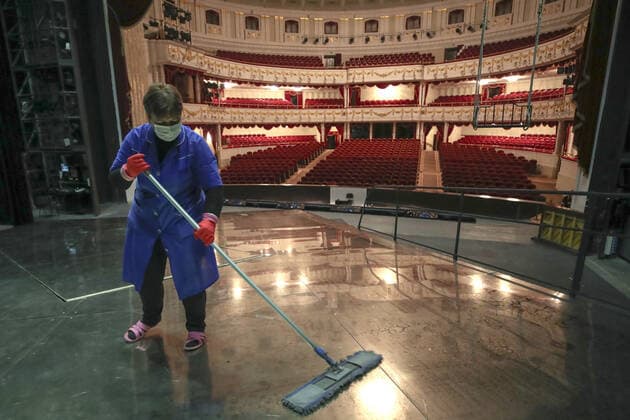 MINSK, BELARUS - MAY 22, 2020: A worker washing the floor of a stage of the National Academic Bolshoi Opera and Ballet Theater of the Republic of Belarus. Natalia Fedosenko TASS  TS0DA009