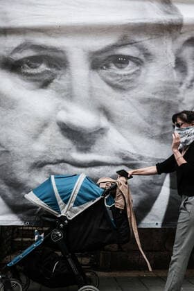 May 24, 2020, Jerusalem, Israel: Opposing groups of protesters gather outside the Prime Minister s Residence in Jerusalem before NetanyahuÃ¢â‚¬â ¢s trial opens later today on charges of bribery, fraud and breach of trust at the Jerusalem District Court. Black Flag protesters represent the danger corruption poses to democracy, while others accuse Attorney General Mandelblit, NetanyahuÃ¢â‚¬â ¢s personal appointment, of succumbing to left wing political pressure. Unprecedented, Netanyahu will become IsraelÃ¢â‚¬â ¢s first serving prime minister to go on criminal trial. Jerusalem Israel - ZUMAa126 20200524_zap_a126_018 Copyright: xNirxAlonx