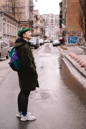 Happy non-binary female hipster standing on the road in city CR_DMBE200504-348588-01,model released, Symbolfoto