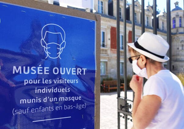 (200601) -- PARIS, June 1, 2020 -- A sign reading Museum opened. Please wear a mask except for small children is seen outside a residence in Paris, France, May 31, 2020. France will further unwind anti-coronavirus lockdown from June 2, lifting 100-km travel restriction and allowing non-essential businesses, parks and beaches to reopen, Prime Minister Edouard Philippe announced on May 28. ) FRANCE-PARIS-COVID-19 GaoxJing 