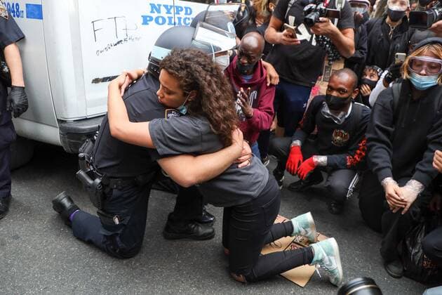June 2, 2020, New York, New York, United States: A girl after negotiating for long minutes convinced two NYPD officers to kneel along with the other protesters in support of the fight against racism and George Floyd s memory and after hugging each other, she was quite disgusted with the other officers who refused to do the same, and punched the glass of the vehicle that burst, and was immobilized and detained in the Soho neighborhood on Manhattan Island in New York City in the United States on Tuesday night, 02. New York United States - ZUMAv122 20200602_zap_v122_041 Copyright: xWilliamxVolcovx