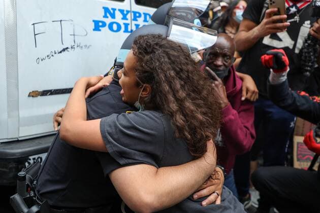 June 2, 2020, New York, New York, United States: A girl after negotiating for long minutes convinced two NYPD officers to kneel along with the other protesters in support of the fight against racism and George Floyd s memory and after hugging each other, she was quite disgusted with the other officers who refused to do the same, and punched the glass of the vehicle that burst, and was immobilized and detained in the Soho neighborhood on Manhattan Island in New York City in the United States on Tuesday night, 02. New York United States - ZUMAv122 20200602_zap_v122_040 Copyright: xWilliamxVolcovx