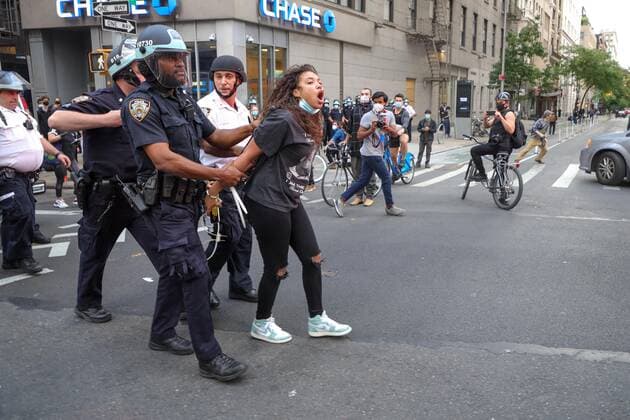 June 2, 2020, New York, New York, United States: A girl after negotiating for long minutes convinced two NYPD officers to kneel along with the other protesters in support of the fight against racism and George Floyd s memory and after hugging each other, she was quite disgusted with the other officers who refused to do the same, and punched the glass of the vehicle that burst, and was immobilized and detained in the Soho neighborhood on Manhattan Island in New York City in the United States on Tuesday night, 02. New York United States - ZUMAv122 20200602_zap_v122_052 Copyright: xWilliamxVolcovx