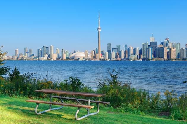 Toronto skyline in the day over lake with urban architecture viewed from park  202820630793551878