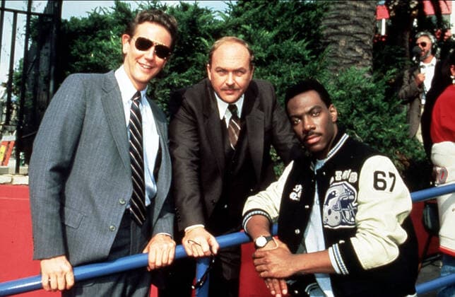 BEVERLY HILLS COP II BEVERLY HILLS COP II JUDGE REINHOLD, JOHN ASHTON, EDDIE MURPHY Date: 1987. Strictly editorial use only in conjunction with the promotion of the film. Credit line mandatory. This image is copyright of the film company and is supplied under the terms of issue as film still. No commercial or book cover use permitted without prior consent from the film company.  Mandatory credit line: Image courtesy PARAMOUNT PICTURES Ronald Grant Archive Mary Evans