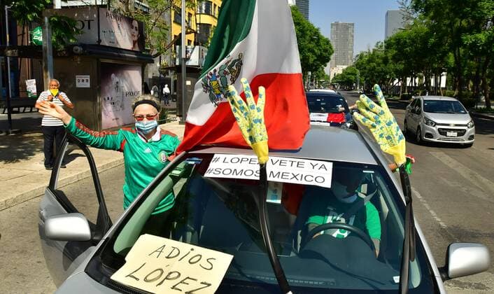Hundreds of people take part in a caravan with their vehicles through the central avenues of Paseo de la Reforma and Juarez, to demand the resignation of President Andres Manuel Lopez Obrador, in Mexico City, Mexico, 14 June 2020. On board their cars, hundreds of Mexicans in various cities in the country protested this Sunday for the second time in less than three weeks against the president s policies. Second caravan of protest against Lopez Obrador in Mexico City !ACHTUNG: NUR REDAKTIONELLE NUTZUNG!  Copyright: xJorgexNúnezx AME6695 20200614-637277723866396164