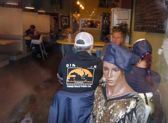 (200615) -- VANCOUVER, June 15, 2020 (Xinhua) -- A mannequin is used to block off a seat at Roundel Cafe to give diners enough physical distance in Vancouver, British Columbia, Canada, on June 15, 2020. As restaurants were reopened under health safety protocols in Vancouver, the restaurant Roundel Cafe found its way by using mannequins instead of cordoned-off seats to help diners practice physical distancing. (Photo by Liang Sen Xinhua) CANADA-VANCOUVER-COVID-19-RESTAURANT-PHYSICAL DISTANCE 