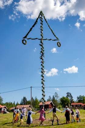 People dance around the maypole in Sahl, Sweden June 19, 2020. In the small village of Sahl in Dalarna midsummer is celebrated to a lesser extent and the elderly in the village stay at home or keep a distance due to the corona pandemic. Photo Ulf Palm TT Kod 9110 SÄHL Sweden x9110x  Copyright: xUlfxPalm TTx MIDSUMMER CELEBRATION SWEDEN