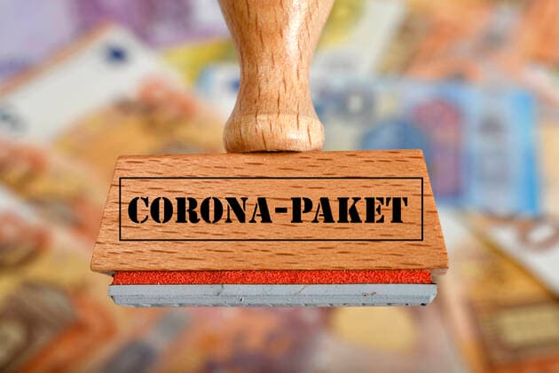 Symbolbild Konjunkturpaket während Corona-Krise, Stempel mit Aufschrift CORONA-PAKET, Deutschland Symbolbild Stempel