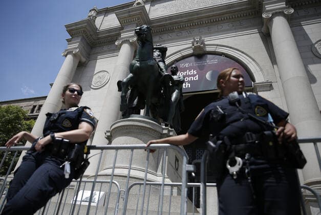 Police barricades surround the area around a bronze statue of former President Theodore Roosevelt at the American Museum Of Natural History in New York City on Monday, June 22, 2020. The statue of the 26th president flanked by walking Native American and African figures was unveiled to the public in front of the museum s Central Park West entrance in 1940. Statues in the United States and around the world have been knocked down, removed and vandalized as a debate swirls over monuments that represent possible racial oppression.  NYP20200622105 JOHNxANGELILLO