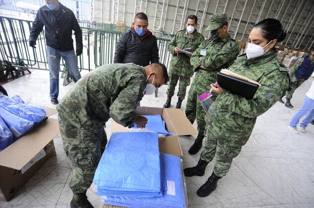 Military officers wear face masks while organizing medical supplies in the General Health Warehouse to be distributed in the country s various hospitals to treat patients infected with COVID-19. Where: Mexico City, Mexico When: 22 Jun 2020 Credit: Eyepix Cover Images **EDITORIAL USE ONLY** Copyright: xRicardoxCastelanxCruzx 40665349 EDITORIAL USE ONLY. NOT FOR USE BY NEWSPAPERS BASED IN THE UK.