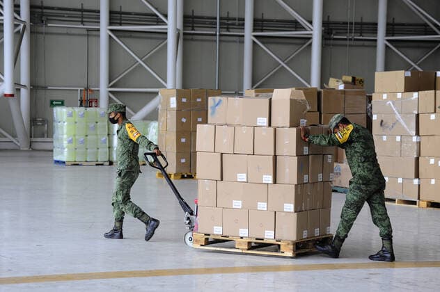 Military officers wear face masks while organizing medical supplies in the General Health Warehouse to be distributed in the country s various hospitals to treat patients infected with COVID-19. Where: Mexico City, Mexico When: 22 Jun 2020 Credit: Eyepix Cover Images **EDITORIAL USE ONLY** Copyright: xRicardoxCastelanxCruzx 40665350 EDITORIAL USE ONLY. NOT FOR USE BY NEWSPAPERS BASED IN THE UK.