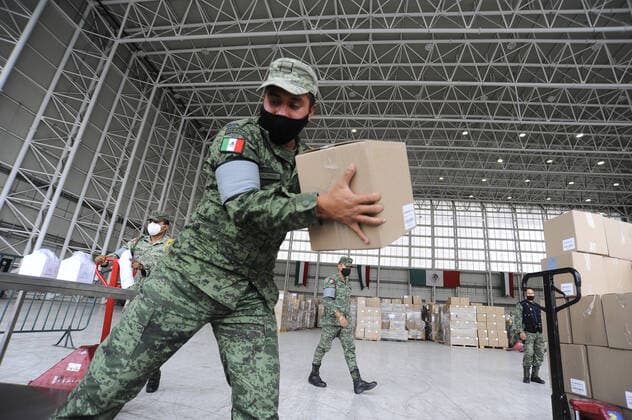 Military officers wear face masks while organizing medical supplies in the General Health Warehouse to be distributed in the country s various hospitals to treat patients infected with COVID-19. Where: Mexico City, Mexico When: 22 Jun 2020 Credit: Eyepix Cover Images **EDITORIAL USE ONLY** Copyright: xRicardoxCastelanxCruzx 40665353 EDITORIAL USE ONLY. NOT FOR USE BY NEWSPAPERS BASED IN THE UK.