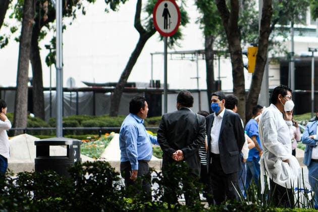 (200623) -- MEXICO CITY, June 23, 2020 -- People are seen on a street after an earthquake in Mexico City, capital of Mexico, on June 23, 2020. An earthquake with a magnitude of 7.4 jolted 12 km SSW of Santa Maria Zapotitlan of Mexico at 15:29:05 GMT on Tuesday, the U.S. Geological Survey said. ) MEXICO-MEXICO CITY-EARTHQUAKE XinxYuewei 