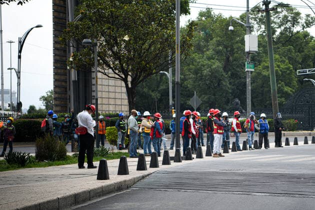 (200623) -- MEXICO CITY, June 23, 2020 -- People are seen on a street after an earthquake in Mexico City, capital of Mexico, on June 23, 2020. An earthquake with a magnitude of 7.4 jolted 12 km SSW of Santa Maria Zapotitlan of Mexico at 15:29:05 GMT on Tuesday, the U.S. Geological Survey said. ) MEXICO-MEXICO CITY-EARTHQUAKE XinxYuewei 