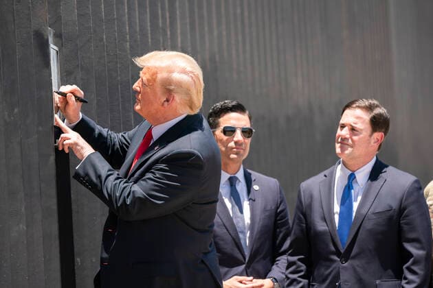 June 23, 2020 - Yuma, Arizona - President DONALD TRUMP signs a plaque Tuesday, June 23, 2020, commemorating the 200th mile of new border wall along the U.S.-Mexico border near Yuma. Yuma USA - ZUMAz03_ 20200623_sha_z03_407 Copyright: xWhitexHousex