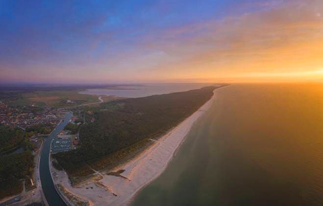 Poland, Pomerania, Leba, Aerial view of coastline at Slowinski National Park at sunset HAMF00608